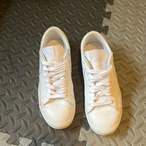 Women’s all white Nike shoes